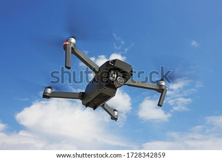 Flying Drone in a blue sky