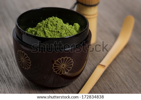 Japanese tea ceremony setting on old wooden bench. Studio photo. Green tea utensils. Close up. Royalty-Free Stock Photo #172834838