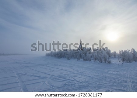 Scenic view of a church in a snowy forest near the border between Finland and Sweden