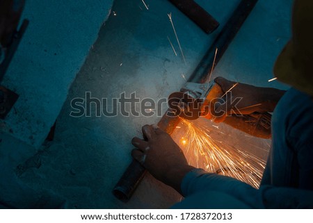 Electric wheel grinding on steel structure  in the construction site