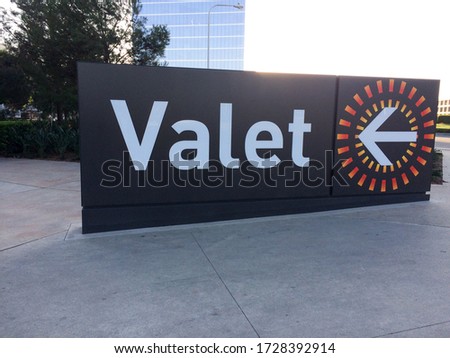 Valet parking sign big on ground entrance garage level outdoor