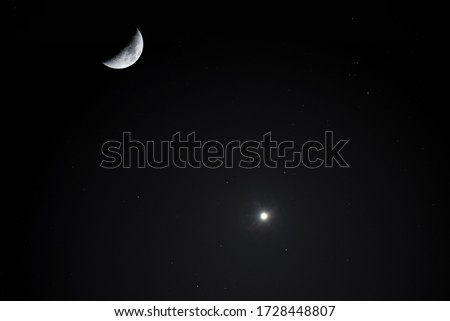 Astronomical photography. Close-up moon and venus planet on the dark sky. Night photography.