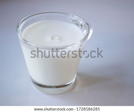 Transparent Glass of milk with bubble 