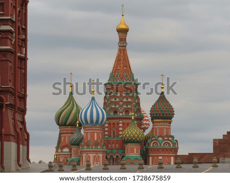 Photography of the domes of the Saint Basil's Cathedral / Cathedral of Vasily the Blessed. Moscow Red Square. The wall of the State Historical Museum. Coronavirus pandemic time. No people.