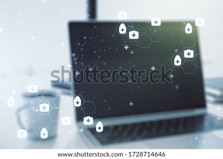 Double exposure of creative abstract medical hologram on laptop background. Healthcare technolody concept