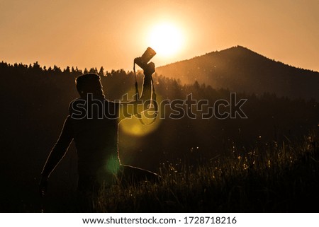 Photographer silhouette in sunset light