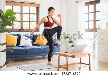 Young Asian healthy woman workout at home, exercise, fit, doing yoga, home fitness concept Royalty-Free Stock Photo #1728718522