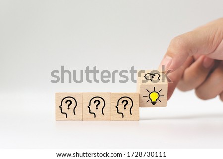 Hand flip over wooden cube block with head human symbol and light bulb icon. Concept creative idea and innovation Royalty-Free Stock Photo #1728730111
