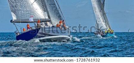 Sailing yacht regatta. Sailboats under sail in the race Royalty-Free Stock Photo #1728761932