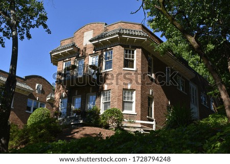 Old house on a hill with nice landscaping