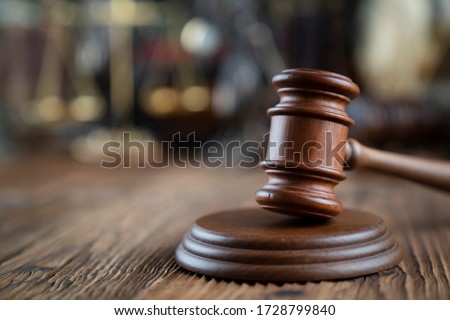 Law and justice symbols. Bokeh background. Royalty-Free Stock Photo #1728799840