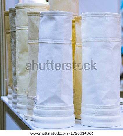 air filter for dust collector system ; Spare part filter bag is for  collect small particles ; engineering equipment industrial background. Royalty-Free Stock Photo #1728814366