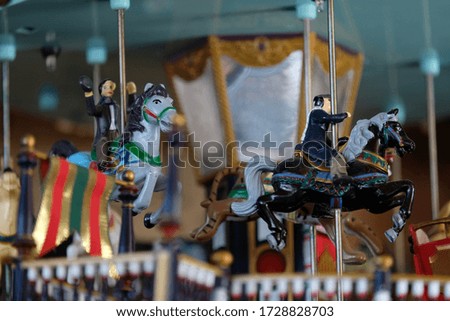 Toy carousel with horses and riders. Decor item