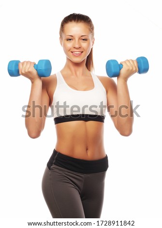 Woman in sport equipment practice with hand weights