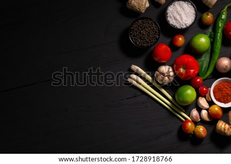 spices with ingredients on dark background. asian food, healthy or cooking concept.