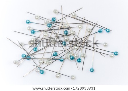 pink pins on white background