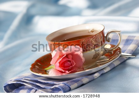 cup of tea with flower over azure