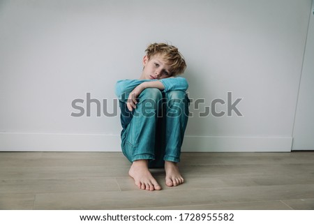 boy feeling anxiety and stress, kid staying home