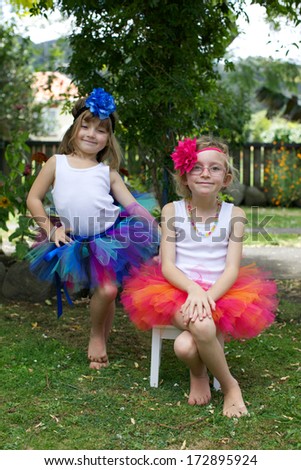 Little girl all dressed up in a colorful tutu.