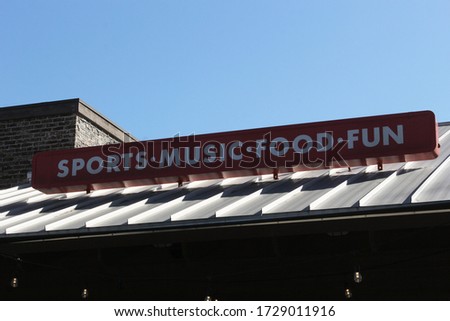Sign on Roof of Sports Bar