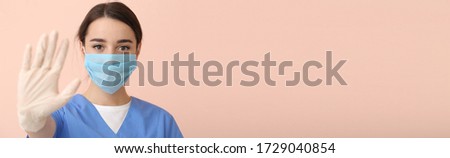 Doctor wearing medical mask against color background with space for text