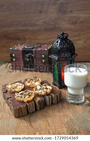 Florentine cookies with cold milk on rustic wooden table