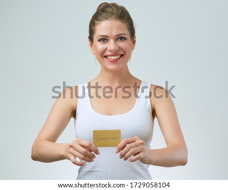 Smiling woman in white singlet top holding card. Sport Training abonnement concept with female portrait.