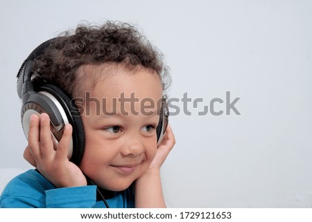 boy with headphones enjoying music   on white background stock photo