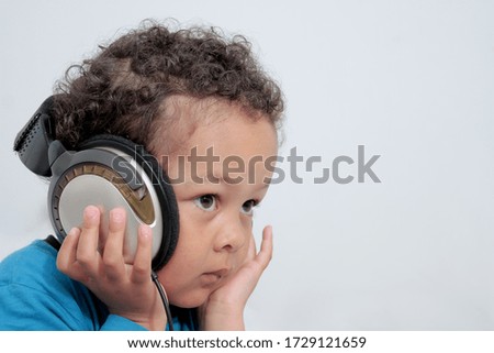 boy with headphones enjoying music   on white background stock photo