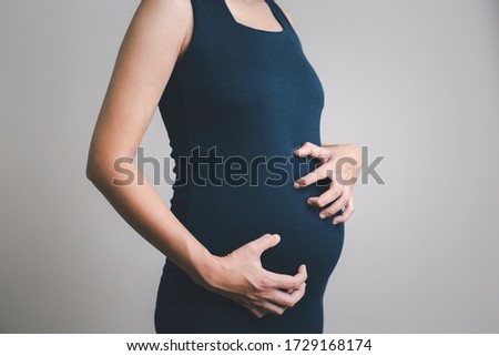 Itching of pregnant women on a white background / Healthcare and medical concepts Royalty-Free Stock Photo #1729168174