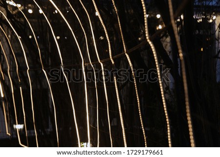 Photo of blurred background with streaks of light.
