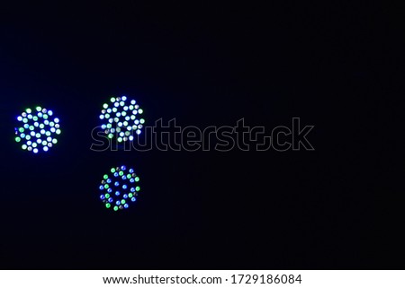 Small and crazy circular patterns of various colors formed by the heavy LED lights