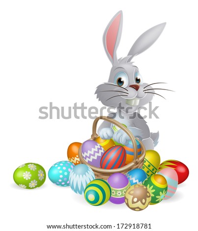 An Easter bunny white rabbit with a basket of painted chocolate Easter eggs