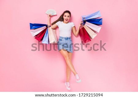 Top above high angle view full length photo shocked girl shop center client win credit bank money fan bags lay scream wear short legs mini jeans skirt isolated pastel color background