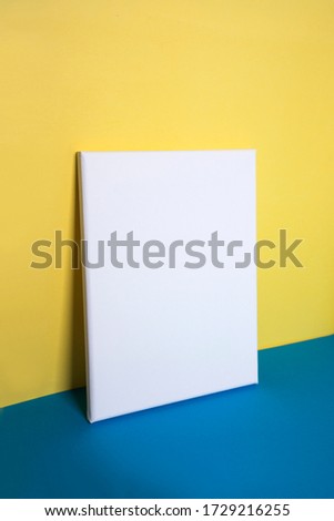 Empty white canvas on coloured background.