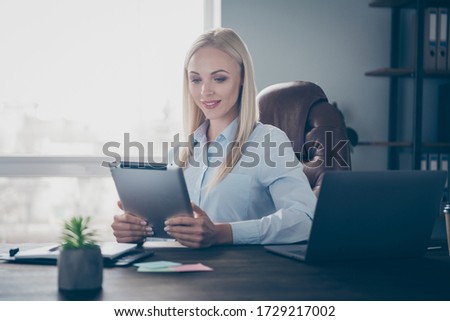 Photo of beautiful business lady notebook table read corporate report e-reader tablet insurance agent recruiter search vacancy wear shirt sitting chair modern interior office indoors