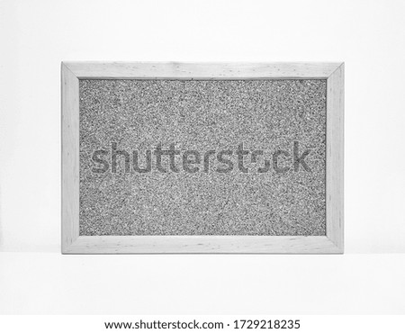 frame for photos or notes with cork on a white background, black and white