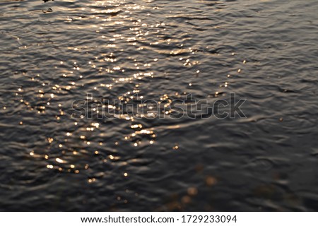 Blurred picture of river with sunlight