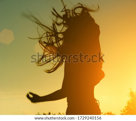 silhouette with an emotional splash. musician or actor in courage against the backdrop of a beautiful sunset