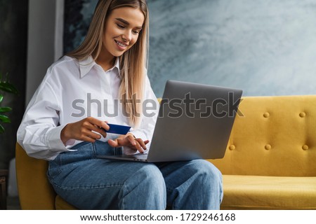 Female using bank card to pay for goods purchased online. Safe payment services for customers of worldwide retailers. Royalty-Free Stock Photo #1729246168