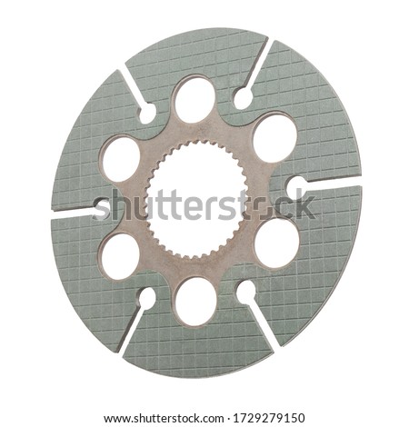 View of matte coated clutch disc of machine with batllement, holes, incisions, and square notching, isolated on white