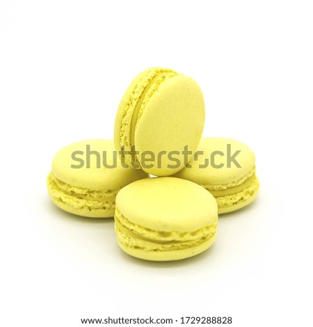 
Yellow lemon macarons on a white background