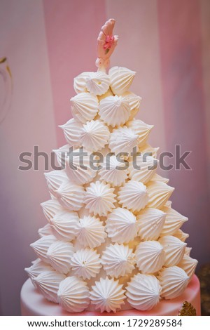 Christmas tree dessert treat made with pink and white meringues . Meringues holiday tree