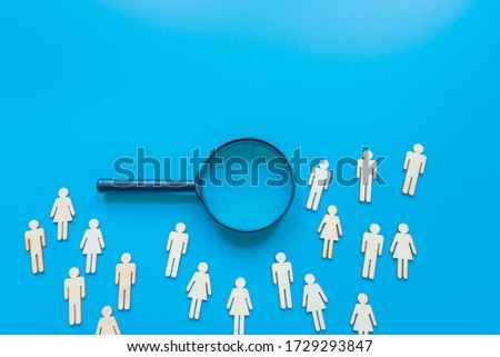 The crowd of wooden figures of people. Concept of business team. Labor collective. Teamwork. Employees. Human Resource Management. Labor market. Demographic situation. Population Royalty-Free Stock Photo #1729293847