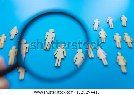 The crowd of wooden figures of people. Concept of business team. Labor collective. Teamwork. Employees. Human Resource Management. Labor market. Demographic situation. Population Royalty-Free Stock Photo #1729294417