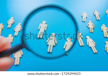The crowd of wooden figures of people. Concept of business team. Labor collective. Teamwork. Employees. Human Resource Management. Labor market. Demographic situation. Population Royalty-Free Stock Photo #1729294423