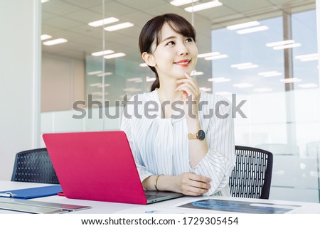 Young asian businesswoman in the office. Royalty-Free Stock Photo #1729305454