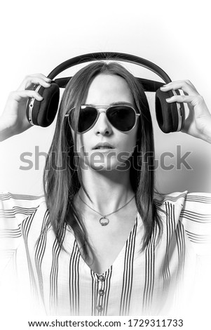 Portrait of a beautiful girl with headphones