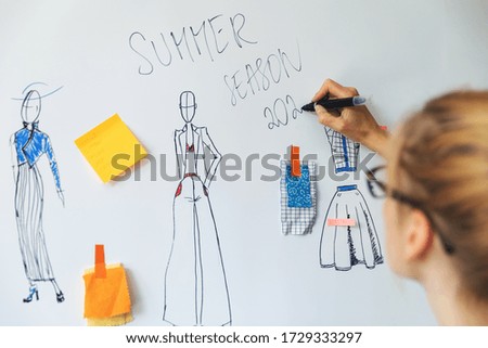 fashion designer working on her new summer clothing collection