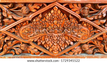 Wood carving in a giant face for background
